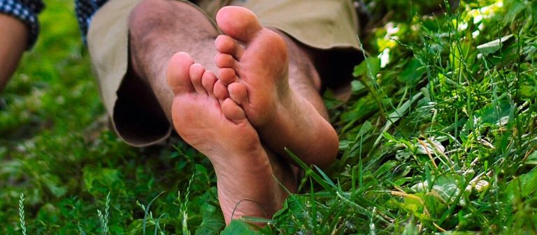 Bare feet in Central Park New York City e1702244998698